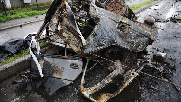 Coche quemado en la región de Donetsk - Sputnik Mundo