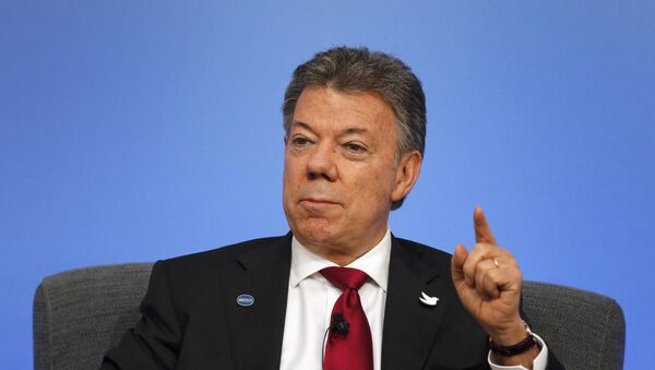 Colombia President Juan Manuel Santos speaks on the podium during a panel discussion at the Anti-Corruption Summit in London, Thursday, May 12, 2016. - Sputnik Mundo