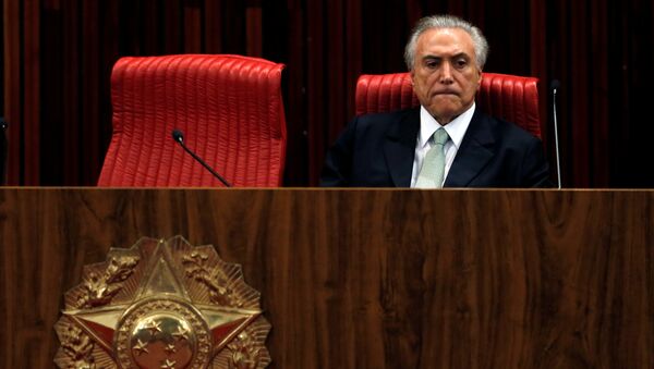 Brazil's interim President Michel Temer reatcs during the inauguration ceremony of Gilmar Mendes as the new president of the Superior Electoral Court in Brasilia - Sputnik Mundo