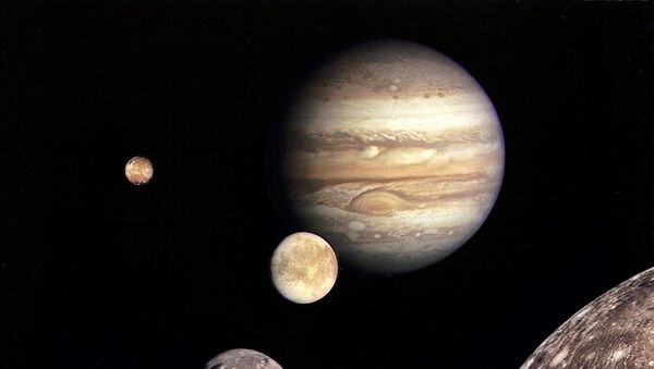 This NASA file image shows Jupiter (REAR) and its four planet-size moons, called the Galilean satellites, were photographed in early March 1979 by Voyager 1 and assembled into this collage. - Sputnik Mundo