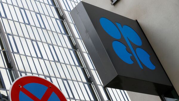 The OPEC logo is pictured behind a traffic sign at its headquarters in Vienna - Sputnik Mundo