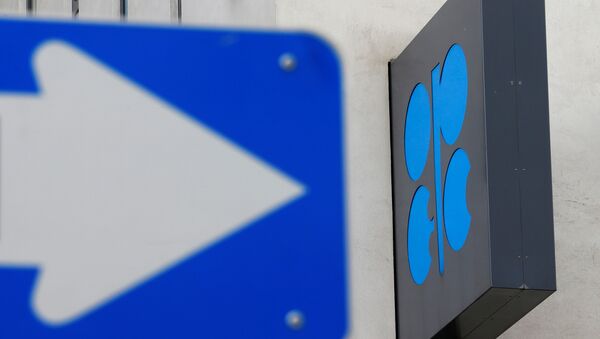 The OPEC logo is pictured behind a traffic sign at its headquarters in Vienna - Sputnik Mundo