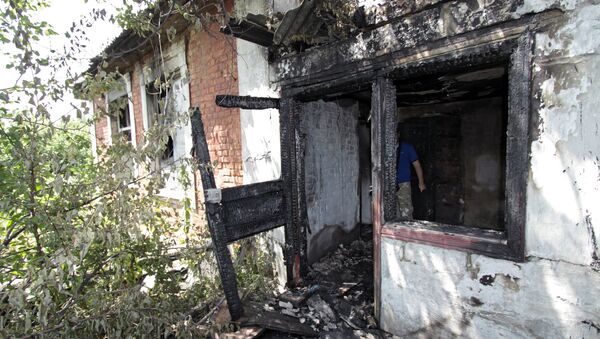 Casa destruida en Donetsk - Sputnik Mundo