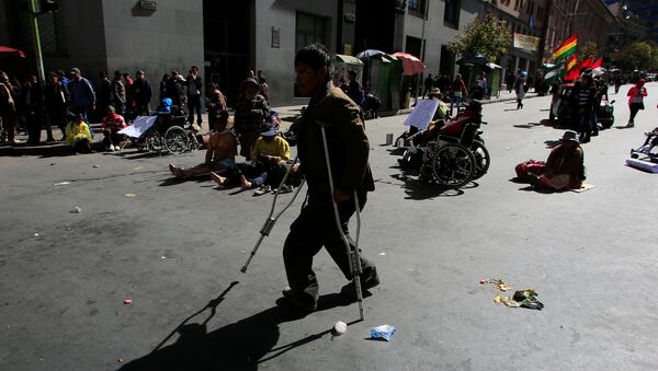 Un discapacitado durante protestas en La Paz (archivo) - Sputnik Mundo