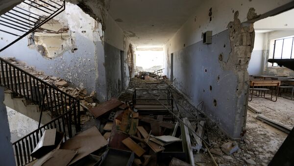 Un edificio destruido en Idlib, Siria - Sputnik Mundo