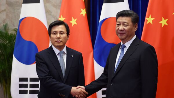 El primer ministro de Corea del Sur, Hwang Kyo-ahn y el presidente chino, Xi Jinping - Sputnik Mundo