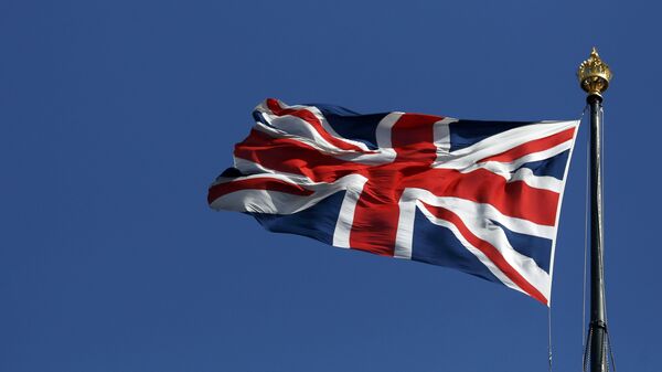 The union flag flies over the Houses of Parliament in Westminster, in central London - Sputnik Mundo