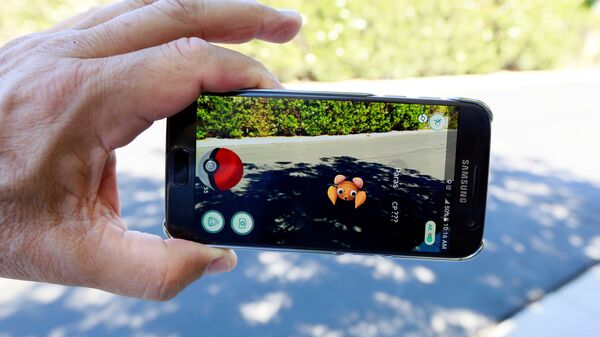 The augmented reality mobile game Pokemon Go by Nintendo is shown on a smartphone screen in this photo illustration taken in Palm Springs, California U.S. July 11, 2016.  - Sputnik Mundo