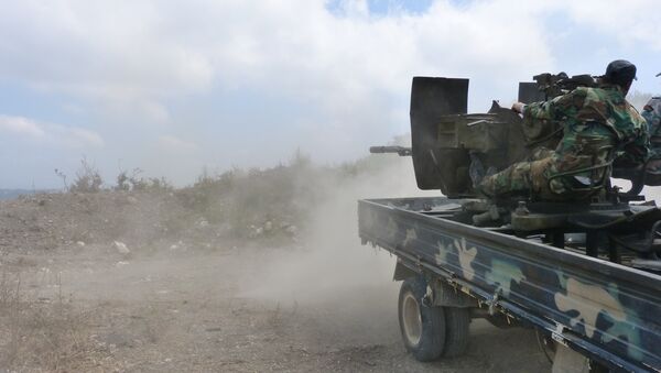 El Ejército sirio durante los combates en los suburbios de la ciudad de Salamiyah, en la provincia de Hama - Sputnik Mundo