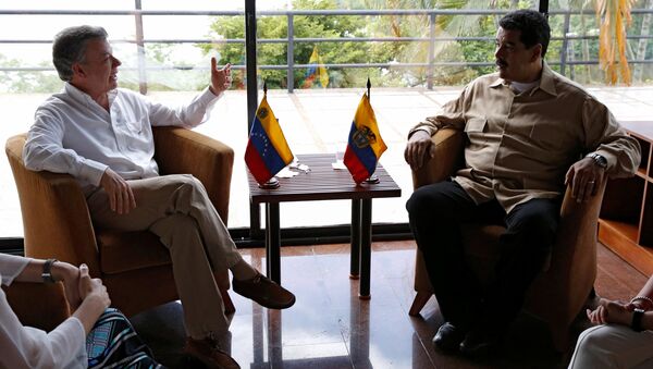 Presidente de Colombia, Juan Manuel Santos, y presidente de Venezuela, Nicolás Maduro - Sputnik Mundo