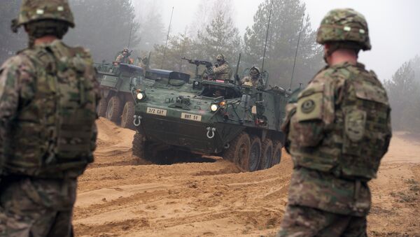 Picture taken on February 26, 2015 shows armored fighting vehicles IAV Stryker of the US Cavalry Regiment 2nd subdivision during training with Latvian an Canadian soldiers at the Adazi military training area in Latvia - Sputnik Mundo