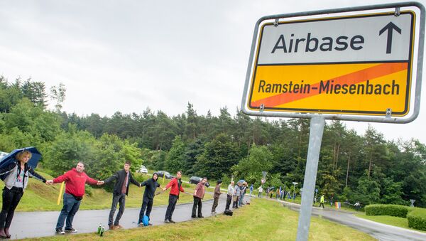 Activists attend a rally Stop-Ramstein on the road leading to US Air Force Base in Ramstein-Miesenbach on June 11, 2016 - Sputnik Mundo
