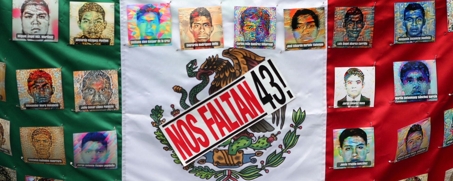 A Mexican flag and some pictures of the 43 missing students is seen in a march to demand justice for the 43 missing students of Ayotzinapa College Raul Isidro Burgos to mark the two-year anniversary of their disappearance in the state of Guerrero, in Mexico City, Mexico, September 26, 2016. - Sputnik Mundo, 1920, 15.06.2021