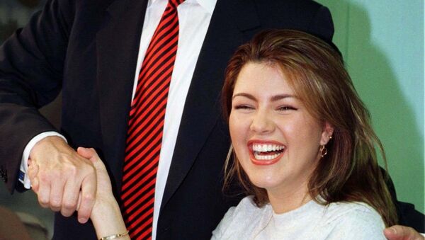 File photo of Miss Universe 1996, Alicia Machado of Venezuela, greeted by businessman Donald Trump during a staged workout at a gym in New York - Sputnik Mundo