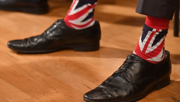 A delegate wears Union flag themed socks as he listens to a keynote address on the third day of the annual Conservative Party conference at the International Convention Centre in Birmingham, central England, on October 4, 2016. - Sputnik Mundo