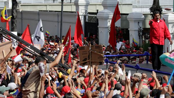El presidente de Venezuela, Nicolás Maduro, durante las manifestaciones en Caracas - Sputnik Mundo
