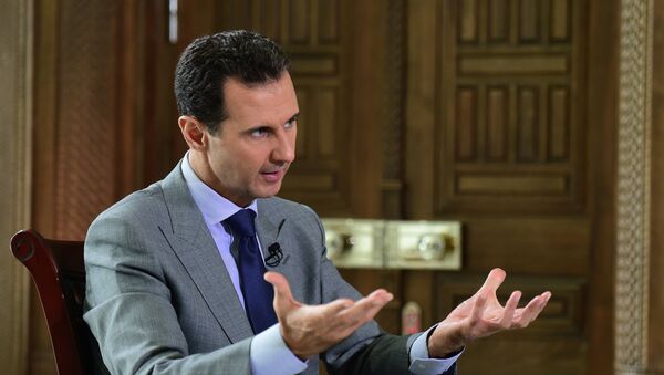 Syria's President Bashar al-Assad speaks during an interview with Russian tabloid Komsomolskaya Pravda, in this handout picture provided by SANA on October 14, 2016 - Sputnik Mundo
