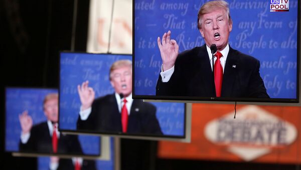 Donald Trump is shown on TV monitors in the media filing room on the campus of University of Nevada, Las Vegas, during the last 2016 U.S. presidential debate in Las Vegas, US, October 19, 2016. - Sputnik Mundo