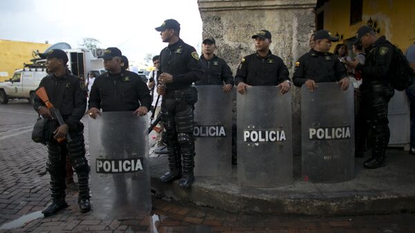 Riot police stand guard close to the venue where the Colombian government and Revolutionary Armed Forces of Colombia will sign a peace agreement to end more than five decades of conflict, in Cartagena, Colombia, Monday, Sept. 26, 2016 - Sputnik Mundo