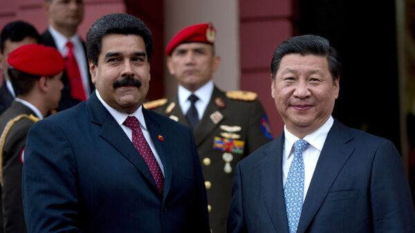 China's President Xi Jinping, right, shakes hand of Venezuela's President Nicolas Maduro, left, prior their meeting at Miraflores Presidential palace in Caracas, Venezuela, Sunday, July 20, 2014 - Sputnik Mundo