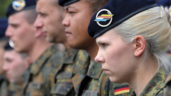 German soldiers of the 291st Jagerbataillon take part in a military ceremony on July 5, 2012 in Illkirch-Graffenstaden, eastern France. The 600 soldiers of the 291st Jägerbataillon, the first German regiment stationed in France since 1945 and who will parade down the Champs-Elysees avenue on July 14, represent a powerful symbol of reconciliation between the two countries - Sputnik Mundo