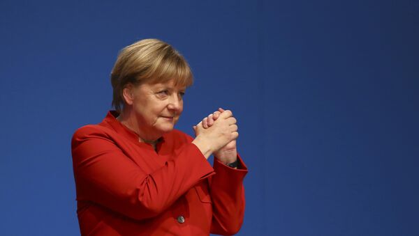 German Chancellor and leader of the conservative Christian Democratic Union party CDU Angela Merkel reacts after her speech at the CDU party convention in Essen, Germany - Sputnik Mundo