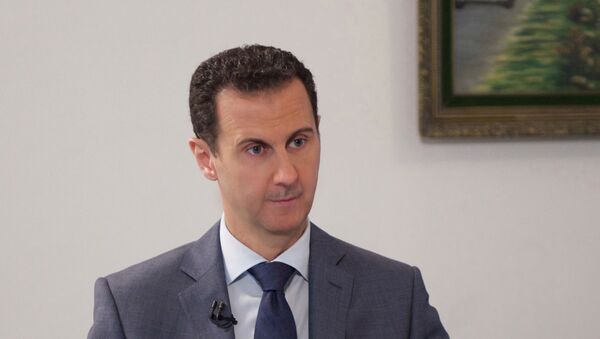 Syria's President Bashar al-Assad speaks during an interview with al-Watan newspaper in Damascus, Syria, in this handout picture provided by SANA on December 8, 2016. - Sputnik Mundo