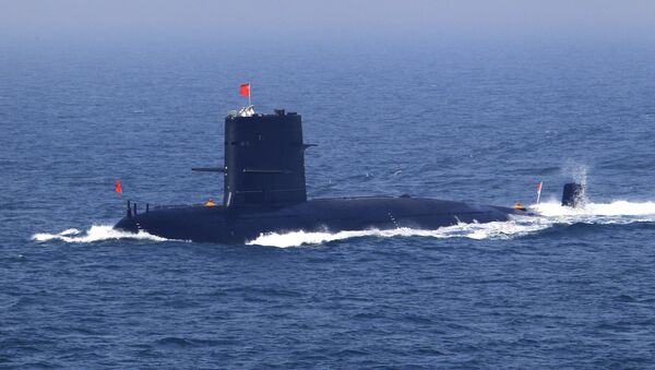 In this April 26, 2012 file photo released by China's Xinhua News Agency, Chinese navy's submarine attends the fleet review of the China-Russia joint naval exercise in the Yellow Sea - Sputnik Mundo