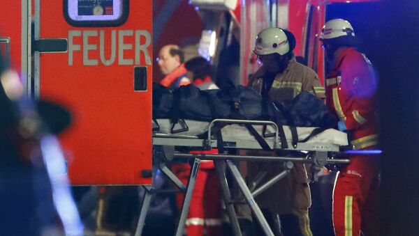 A person is carried into an ambulance at the site of an accident with a truck at a Christmas market on Breitscheidplatz square - Sputnik Mundo