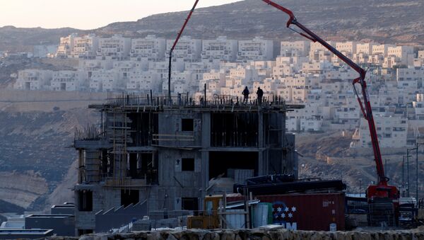 La construcción de asentamientos por Israel en el territorio palestino (archivo) - Sputnik Mundo