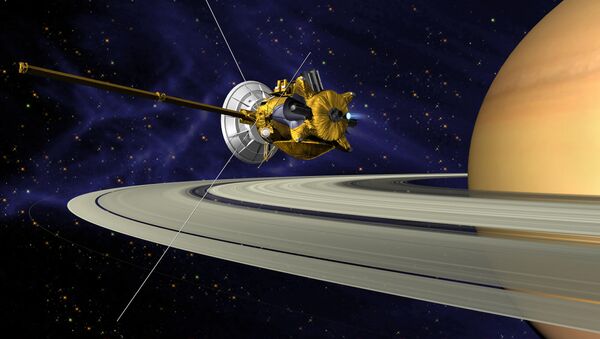 Concepción artística de la sonda Cassini en su maniobra de inserción en la órbita de Saturno - Sputnik Mundo