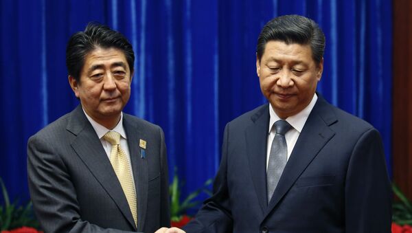 Shinzo Abe y Xi Jinping - Sputnik Mundo