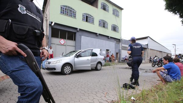Police officers patrol the perimeter at the scene of a fatal shooting in Vila Velha, Espirito Santo, Brazil - Sputnik Mundo