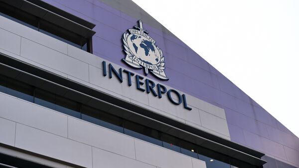 A logo at the newly completed Interpol Global Complex for Innovation building is seen during the inauguration opening ceremony in Singapore on April 13, 2015. The Interpol Global Centre for Innovation opened its doors with officials hoping it will strengthen global efforts to fight increasingly tech-savvy international criminals. - Sputnik Mundo