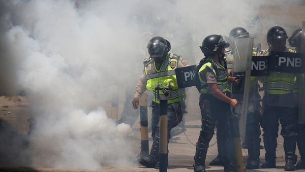 Policía Nacional Bolivariana durante la movilización opositora en Venezuela - Sputnik Mundo