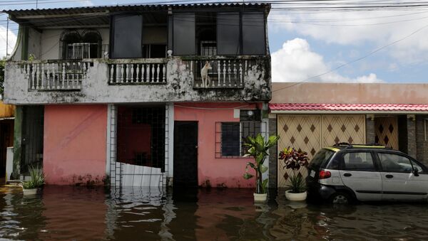 A flooded street is seen after heavy rainfall in Duran - Sputnik Mundo