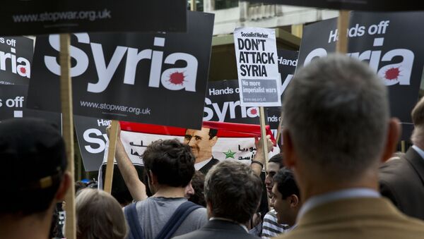Una protesta contra la intervención militar en Siria - Sputnik Mundo