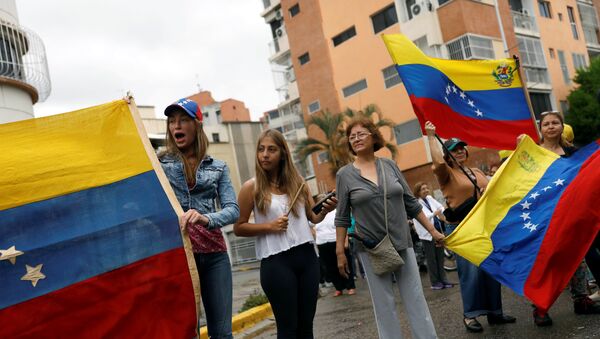 Manifestantes en Caracas, Venezuela - Sputnik Mundo