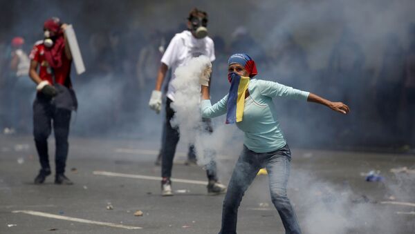 Manifestante en Venezuela - Sputnik Mundo