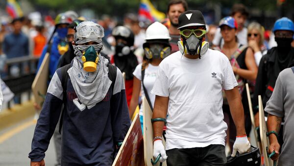 Los manifestantes en Venezuela - Sputnik Mundo