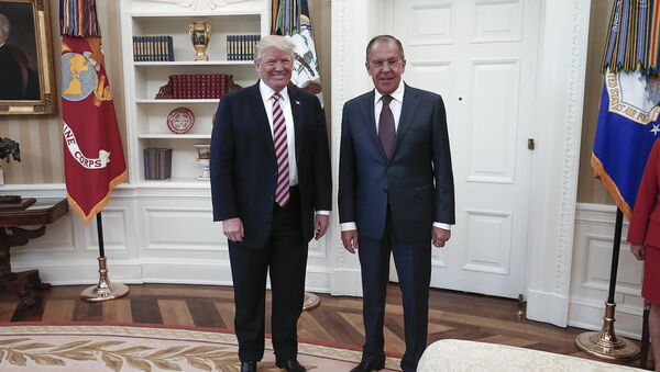 A handout photo made available by the Russian Foreign Ministry on May 10, 2017 shows US President Donald J. Trump (L) posing with Russian Foreign Minister Sergei Lavrov during a meeting at the White House in Washington, DC. - Sputnik Mundo