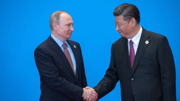 Vladímir Putin, presidente de Rusia y Xi Jinping, presidente de China - Sputnik Mundo
