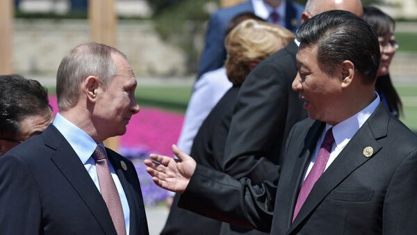 Vladímir Putin, presidente de Rusia, y Xi Jimpin, presidente de China - Sputnik Mundo