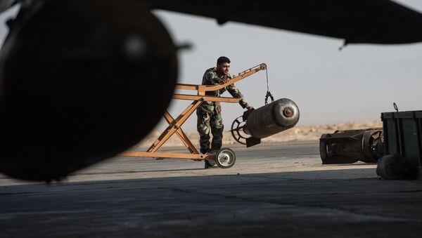 A Syrian army soldier prepares the Su-22 fighter jet for a flight at the Syrian Air Force base in Homs province. File photo - Sputnik Mundo