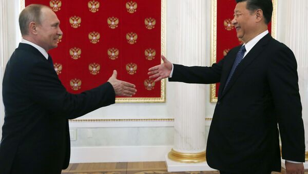 Vladímir Putin, presidente de Rusia, y Xi Jinping, presidente de China - Sputnik Mundo