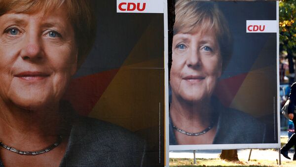 Angela Merkel, canciller de Alemania,  en un poster de la campaña electoral - Sputnik Mundo