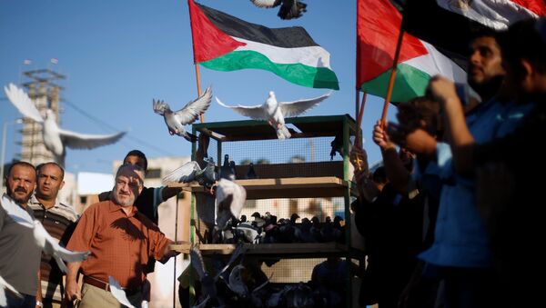 Palestinos celebrando el acuerdo entre Hámas y Al Fatah - Sputnik Mundo