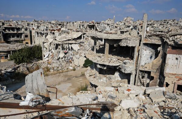 Edificios en ruinas en la ciudad siria de Homs. - Sputnik Mundo