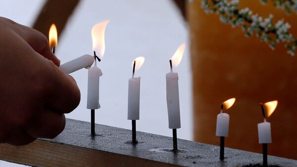 Las velas encendidas - Sputnik Mundo