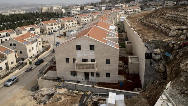 La construcción de un asentamiento israelí en Cisjordania - Sputnik Mundo
